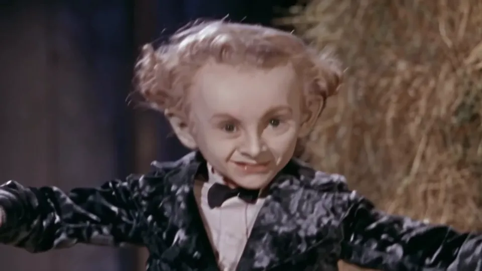 Rumpelstiltskin AI dance: the tiptoe dancer with arms spread in the barn