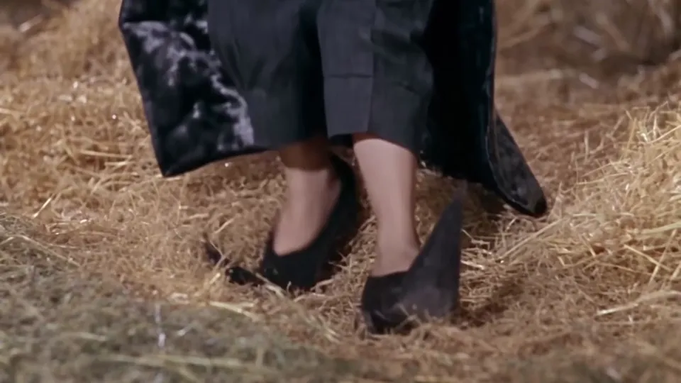 Rumpelstiltskin AI clip close-up of pointy curled-toe shoes skipping on straw