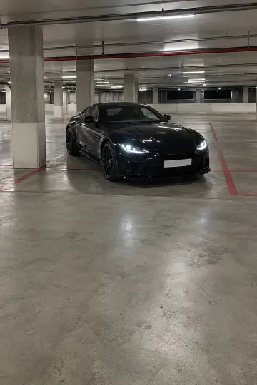 Black coupe · garage