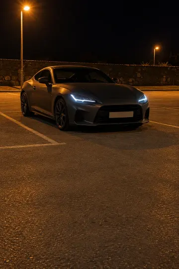 Grey coupe · night lot